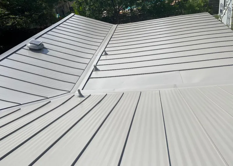 Solar attic fan installed on a metal roof for Roof Ventilation in Holmdel
